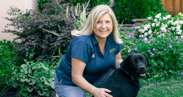 Michelle Willey Bark Busters Home Dog Training National Director of Training with a Labrador