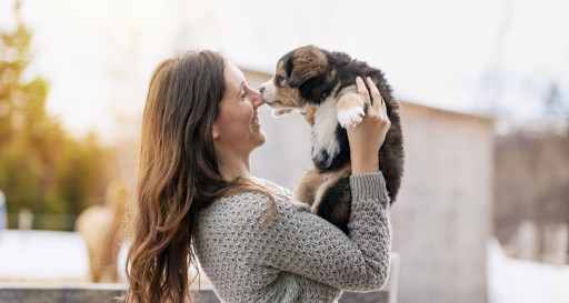 Woman Bringing a Puppy Home