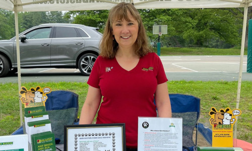 Dog Trainer Nicole Martel at booth for Bark Busters Home Dog Training