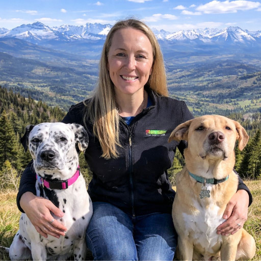 Dog trainer Sara Kroscher with two dogs exploring the Colorado mountains