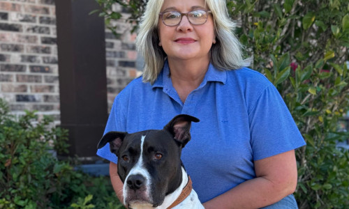 Dog trainer in Mobile Alabama with her dog outside