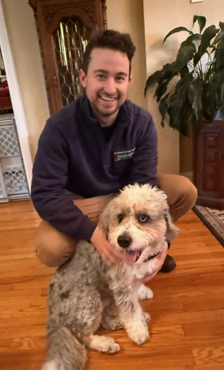 Dog trainer in San Mateo working with a Goldendoodle