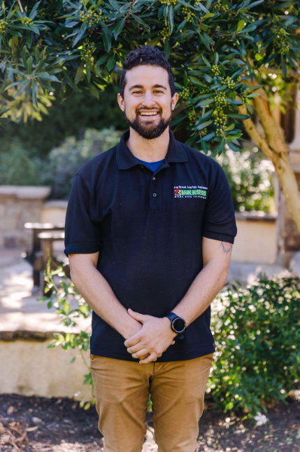 Professional dog trainer Jared Levenson in Bark Busters logo apparel