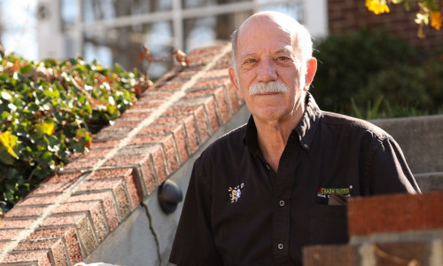 Man with his dog on red brick steps