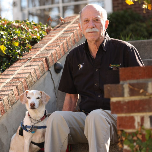 Man with his dog on red brick steps